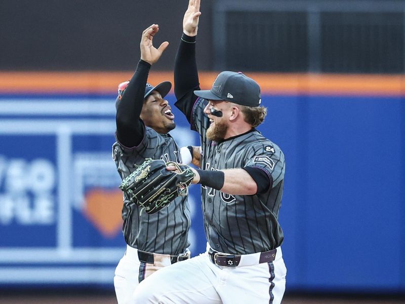 Jul 13, 2024; New York City, New York, USA; New York Mets shortstop Francisco Lindor (12) and center fielder Harrison Bader (44) celebrate after defeating the Colorado Rockies 7-3 at Citi Field. Mandatory Credit: Wendell Cruz-USA TODAY Sports