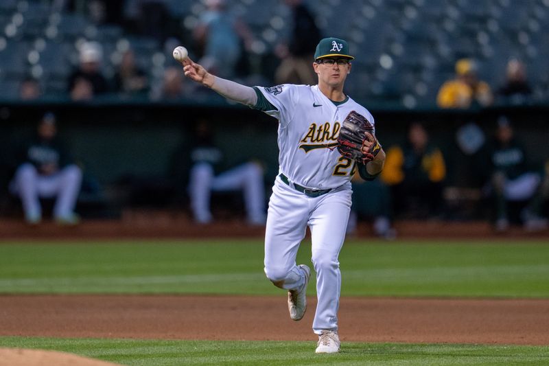 May 30, 2023; Oakland, California, USA;  Oakland Athletics third baseman Jonah Bride (26) throws out Atlanta Braves left fielder Kevin Pillar (not pictured) during the eighth inning at Oakland-Alameda County Coliseum. Mandatory Credit: Neville E. Guard-USA TODAY Sports