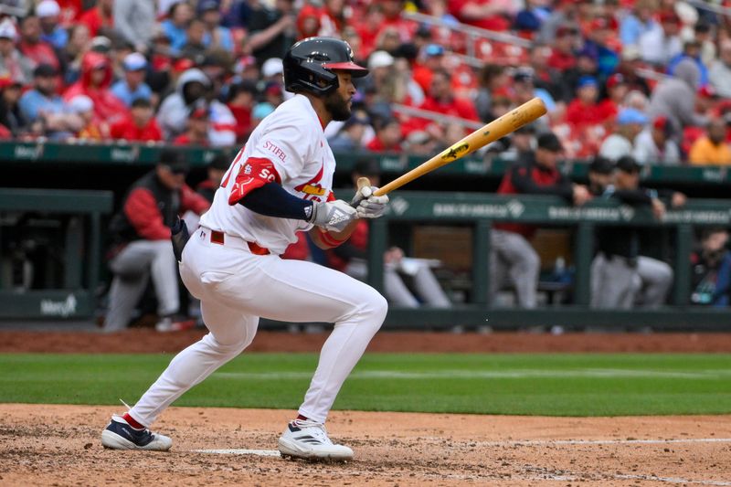 May 25, 2025; St. Louis, Missouri, USA;  St. Louis Cardinals center fielder Victor Scott II (11) hits a one run single against the Arizona Diamondbacks during the seventh inning at Busch Stadium. Mandatory Credit: Jeff Curry-Imagn Images