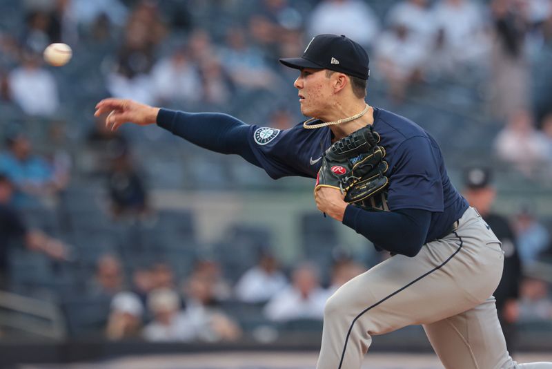 May 21, 2024; Bronx, New York, USA; Seattle Mariners starting pitcher Bryan Woo (22) delivers a pitch during the first inning against the New York Yankees  at Yankee Stadium. Mandatory Credit: Vincent Carchietta-USA TODAY Sports