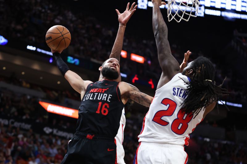 MIAMI, FLORIDA - MARCH 05: Caleb Martin #16 of the Miami Heat drives to the basket against Isaiah Stewart #28 of the Detroit Pistons during the second quarter of the game at Kaseya Center on March 05, 2024 in Miami, Florida. NOTE TO USER: User expressly acknowledges and agrees that, by downloading and or using this photograph, User is consenting to the terms and conditions of the Getty Images License Agreement. (Photo by Megan Briggs/Getty Images)