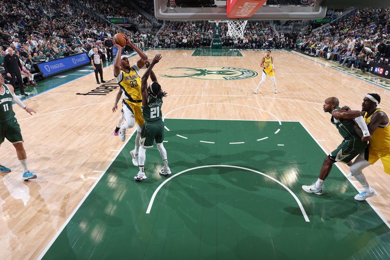 MILWAUKEE, WI - APRIL 21:  Myles Turner #33 of the Indiana Pacers goes to the basket during the game against the Milwaukee Bucks during Round 1 Game 1 of the 2024 NBA Playoffs  on April 21, 2024 at the Fiserv Forum Center in Milwaukee, Wisconsin. NOTE TO USER: User expressly acknowledges and agrees that, by downloading and or using this Photograph, user is consenting to the terms and conditions of the Getty Images License Agreement. Mandatory Copyright Notice: Copyright 2024 NBAE (Photo by Jeff Haynes/NBAE via Getty Images).