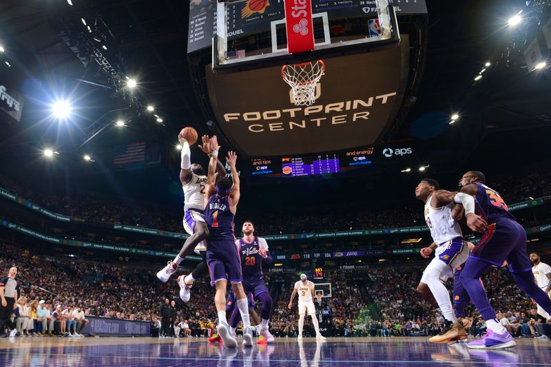 PHOENIX, AZ - FEBRUARY 25: LeBron James #23 of the Los Angeles Lakers drives to the basket during the game against the Phoenix Suns on February 25, 2024 at Footprint Center in Phoenix, Arizona. NOTE TO USER: User expressly acknowledges and agrees that, by downloading and or using this photograph, user is consenting to the terms and conditions of the Getty Images License Agreement. Mandatory Copyright Notice: Copyright 2024 NBAE (Photo by Kate Frese/NBAE via Getty Images)