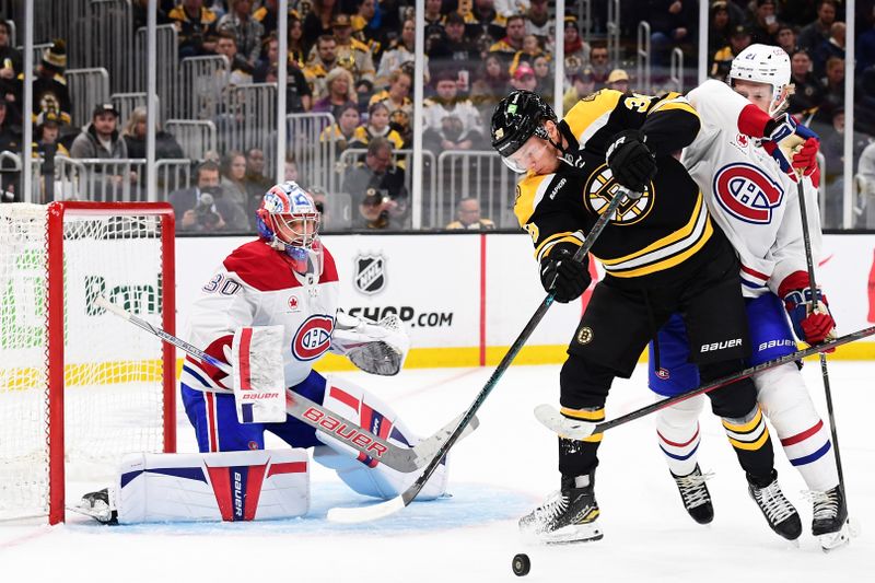 Oct 10, 2024; Boston, Massachusetts, USA; Boston Bruins center Morgan Geekie (39) battles with Montreal Canadiens defenseman Kaiden Guhle (21) in front of goaltender Cayden Primeau (30) during the third period at TD Garden. Mandatory Credit: Bob DeChiara-Imagn Images