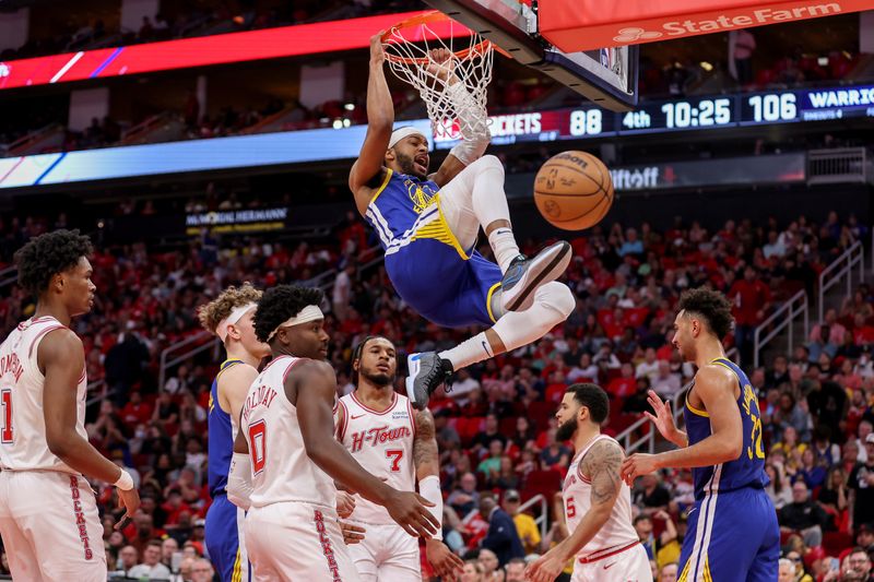 HOUSTON, TEXAS - APRIL 04: Moses Moody #4 of the Golden State Warriors dunks the ball in the second half against the Houston Rockets at Toyota Center on April 04, 2024 in Houston, Texas.  NOTE TO USER: User expressly acknowledges and agrees that, by downloading and or using this photograph, User is consenting to the terms and conditions of the Getty Images License Agreement. (Photo by Tim Warner/Getty Images)