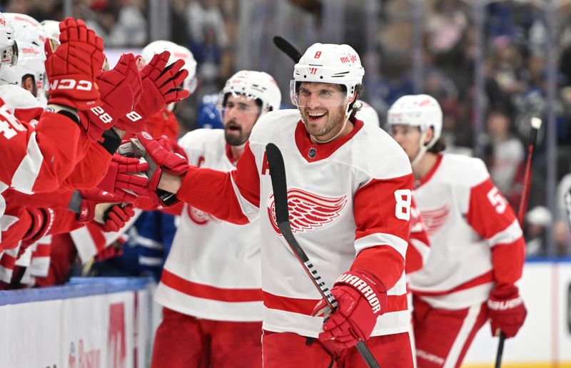 Jan 14, 2024; Toronto, Ontario, CAN;  Detroit Red Wings defenseman Ben Chiarot (8) celebrates after a goal by forward Lucas Raymond (not shown) against the Toronto Maple Leafs in the third period at Scotiabank Arena. Mandatory Credit: Dan Hamilton-USA TODAY Sports