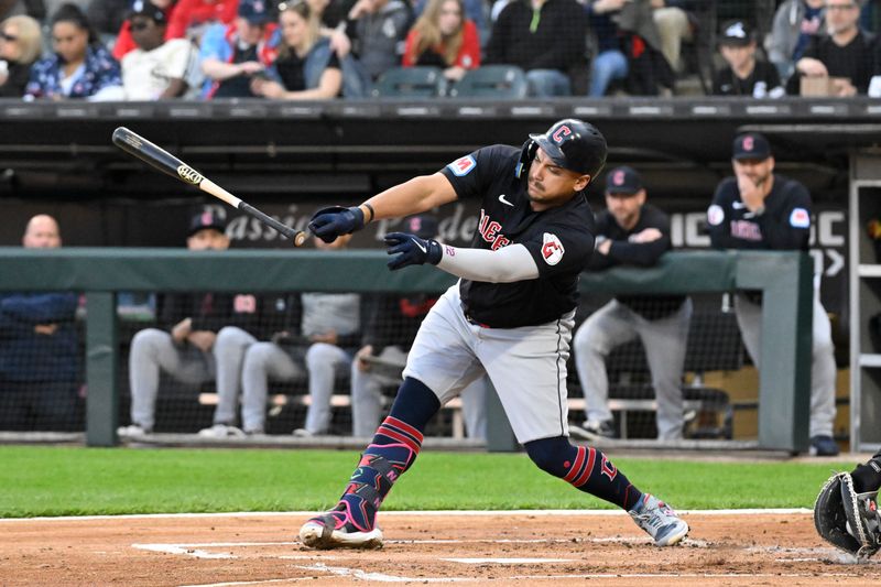 May 10, 2024; Chicago, Illinois, USA;  Cleveland Guardians first base Josh Naylor (22) loses his bat during the first inning against the Chicago White Sox at Guaranteed Rate Field. Mandatory Credit: Matt Marton-USA TODAY Sports