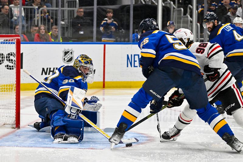 Apr 10, 2024; St. Louis, Missouri, USA;  St. Louis Blues goaltender Joel Hofer (30) defends the net against the Chicago Blackhawks during the third period at Enterprise Center. Mandatory Credit: Jeff Curry-USA TODAY Sports