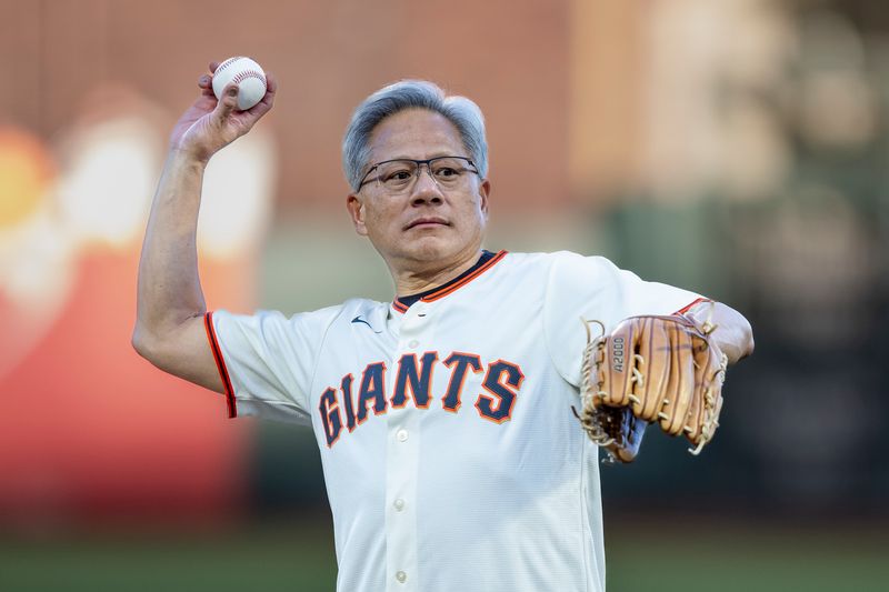 Sep 3, 2024; San Francisco, California, USA;  Nvidia CEO Jensen Huang throws the ceremonial first pitch before the game between the San Francisco Giants and the Arizona Diamondbacks at Oracle Park. Mandatory Credit: John Hefti-Imagn Images