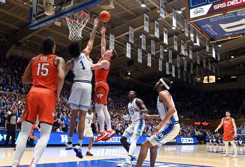 Feb 25, 2023; Durham, North Carolina, USA; Duke Blue Devils center Dereck Lively (1) blocks the shot of Virginia Tech Hokies guard Sean Pedulla (3) during the first half at Cameron Indoor Stadium. Mandatory Credit: Rob Kinnan-USA TODAY Sports