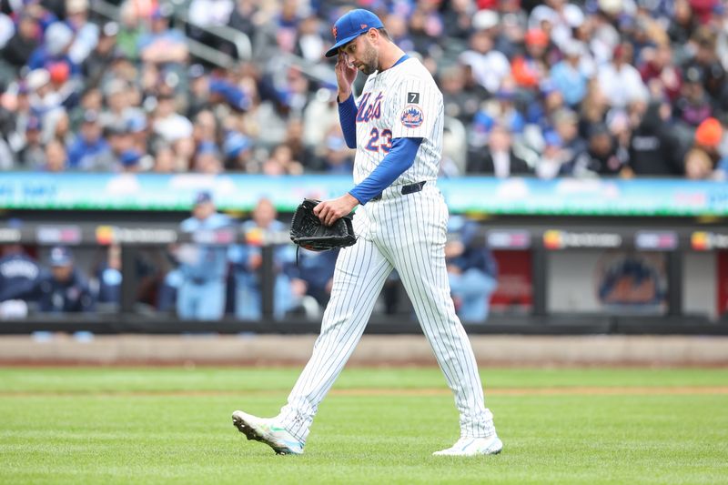 Apr 6, 2025; New York City, New York, USA;  New York Mets starting pitcher David Peterson (23) walks off the field in the fifth inning  against the Toronto Blue Jays at Citi Field. Mandatory Credit: Wendell Cruz-Imagn Images