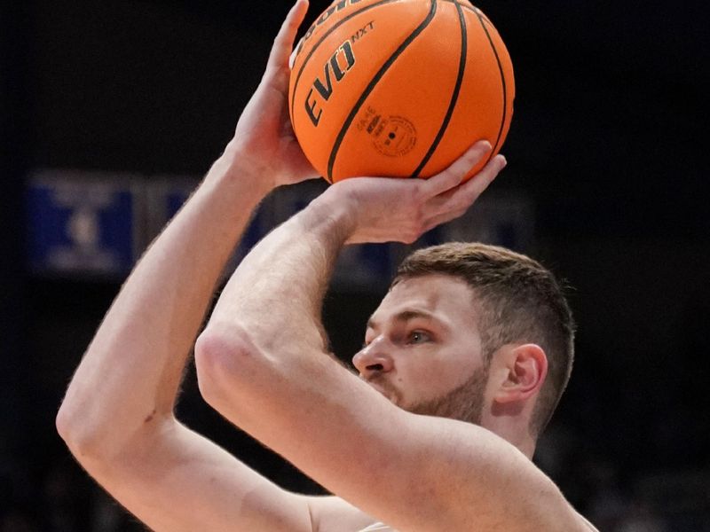 Feb 27, 2024; Lawrence, Kansas, USA; Kansas Jayhawks center Hunter Dickinson (1) shoots a three point shot against the Brigham Young Cougars during the second half at Allen Fieldhouse. Mandatory Credit: Denny Medley-USA TODAY Sports