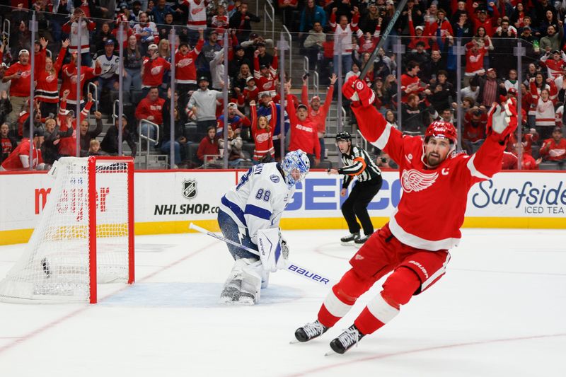 Oct 17, 2025; Detroit, Michigan, USA; Detroit Red Wings center Dylan Larkin (71) scores the game winning goal in overtime against Tampa Bay Lightning goaltender Andrei Vasilevskiy (88) at Little Caesars Arena. Mandatory Credit: Brian Bradshaw Sevald-Imagn Images
