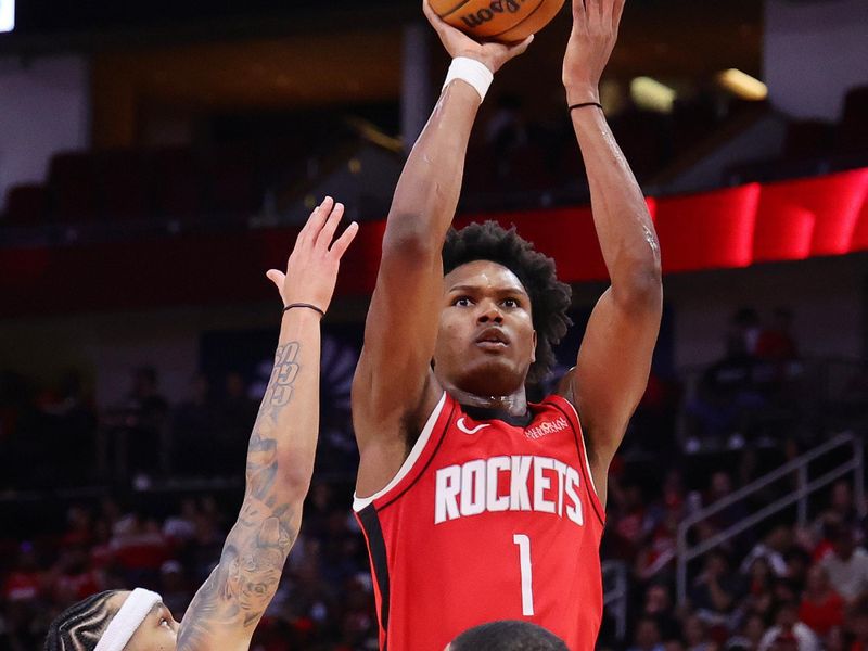 HOUSTON, TEXAS - OCTOBER 23: Amen Thompson #1 of the Houston Rockets shoots over Tre Mann #23 of the Charlotte Hornets during the second half at Toyota Center on October 23, 2024 in Houston, Texas.  NOTE TO USER: User expressly acknowledges and agrees that, by downloading and or using this photograph, User is consenting to the terms and conditions of the Getty Images License Agreement. (Photo by Alex Slitz/Getty Images)