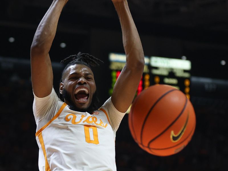 Dec 9, 2023; Knoxville, Tennessee, USA; Tennessee Volunteers forward Jonas Aidoo (0) dunks the ball against the Illinois Fighting Illini during the first half at Food City Center at Thompson-Boling Arena. Mandatory Credit: Randy Sartin-USA TODAY Sports