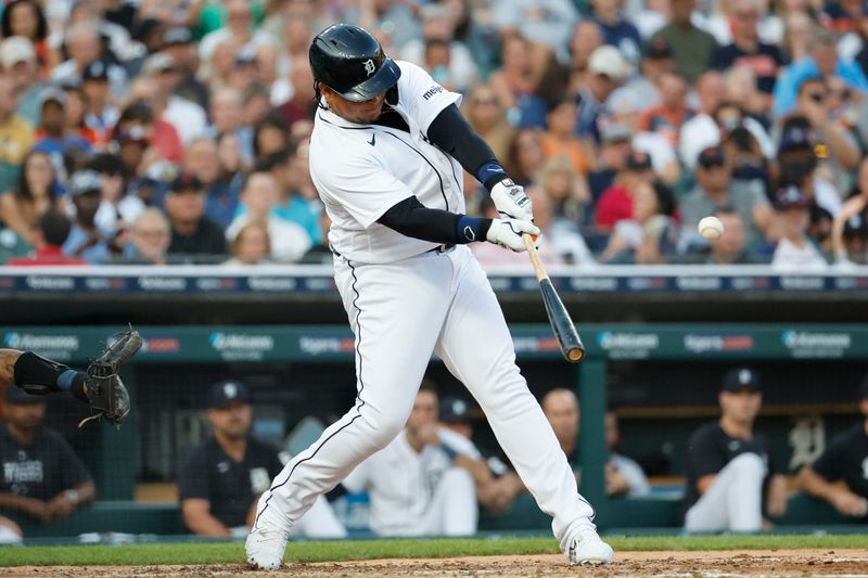 Aug 4, 2023; Detroit, Michigan, USA; Detroit Tigers designated hitter Miguel Cabrera (24) hits a double in the fifth inning against the Tampa Bay Rays at Comerica Park. Mandatory Credit: Rick Osentoski-USA TODAY Sports