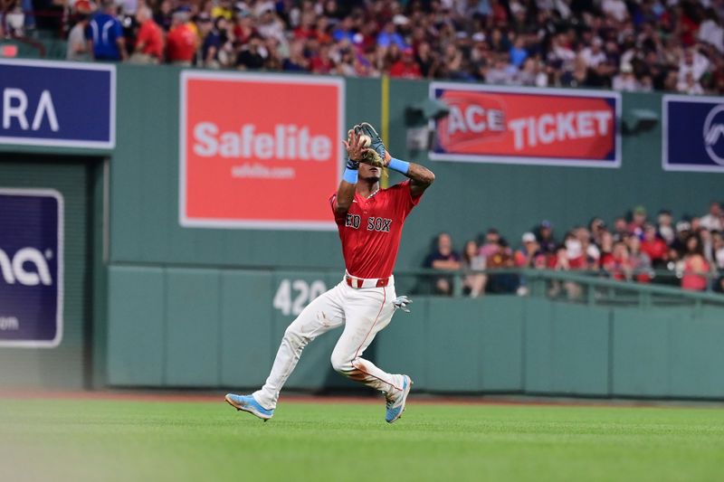 Aug 23, 2024; Boston, Massachusetts, USA; Boston Red Sox shortstop Ceddanne Rafaela (43) makes a catch against the Arizona Diamondbacks during the sixth inning at Fenway Park. Mandatory Credit: Eric Canha-USA TODAY Sports