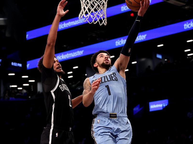 NEW YORK, NEW YORK - NOVEMBER 04: Scotty Pippen Jr. #1 of the Memphis Grizzlies shoots the ball against Cameron Johnson #2 of the Brooklyn Nets during the first half at Barclays Center on November 04, 2024 in the Brooklyn borough of New York City. (Photo by Luke Hales/Getty Images)