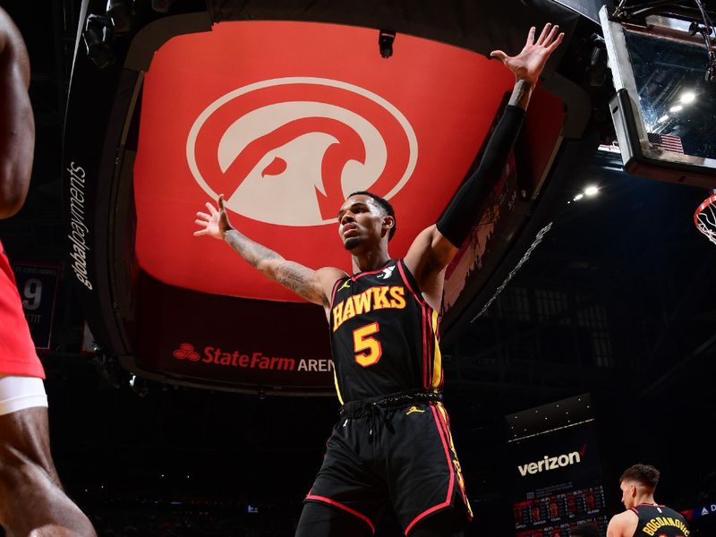 ATLANTA, GA - February 23:  Dejounte Murray #5 of the Atlanta Hawks plays defense during the game against the Toronto Raptors on February 23, 2024 at State Farm Arena in Atlanta, Georgia.  NOTE TO USER: User expressly acknowledges and agrees that, by downloading and/or using this Photograph, user is consenting to the terms and conditions of the Getty Images License Agreement. Mandatory Copyright Notice: Copyright 2024 NBAE (Photo by Scott Cunningham/NBAE via Getty Images)