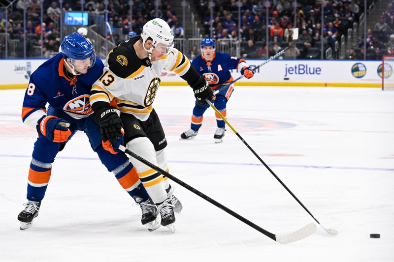 Nov 27, 2024; Elmont, New York, USA;  New York Islanders defenseman Noah Dobson (8) defends against Boston Bruins center Charlie Coyle (13) during the first period at UBS Arena. Mandatory Credit: Dennis Schneidler-Imagn Images