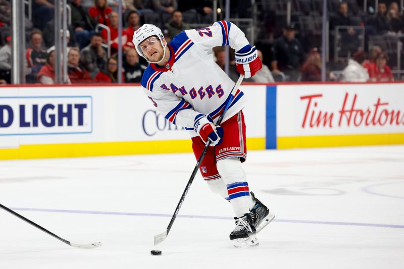 Oct 17, 2024; Detroit, Michigan, USA;  New York Rangers defenseman Adam Fox (23) skates with the puck in the third period against the Detroit Red Wings at Little Caesars Arena. Mandatory Credit: Rick Osentoski-Imagn Images