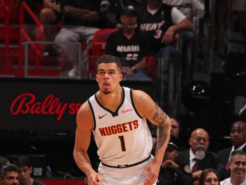 MIAMI, FL - MARCH 13:Michael Porter Jr. #1 of the Denver Nuggets looks on during the game against the Miami Heat on March 13, 2024 at Kaseya Center in Miami, Florida. NOTE TO USER: User expressly acknowledges and agrees that, by downloading and or using this Photograph, user is consenting to the terms and conditions of the Getty Images License Agreement. Mandatory Copyright Notice: Copyright 2024 NBAE (Photo by Issac Baldizon/NBAE via Getty Images)