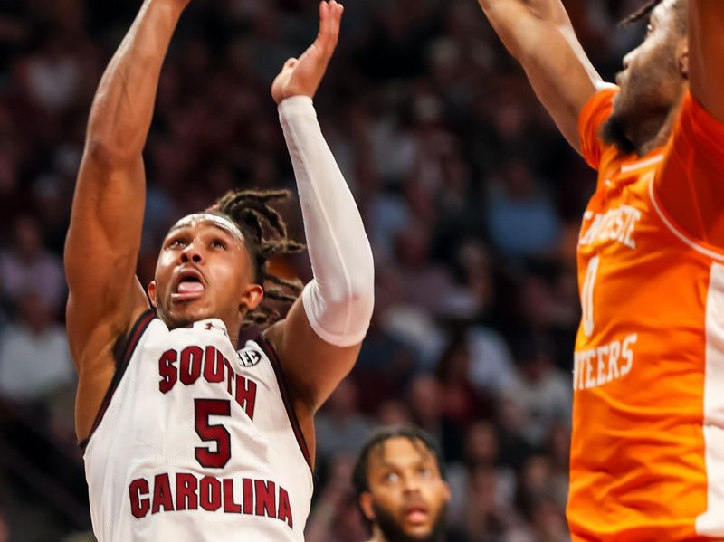 Mar 6, 2024; Columbia, South Carolina, USA; South Carolina Gamecocks guard Meechie Johnson (5) shoots over Tennessee Volunteers forward Jonas Aidoo (0) in the second half at Colonial Life Arena. Mandatory Credit: Jeff Blake-USA TODAY Sports