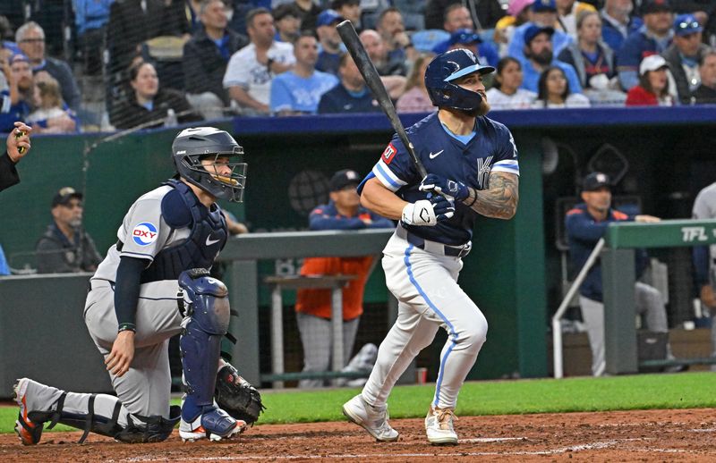 Apr 25, 2025; Kansas City, Missouri, USA;  Kansas City Royals center fielder Kyle Isbel (28) hits a sacrifice fly to score a run in the fifth inning against the Houston Astros at Kauffman Stadium. Mandatory Credit: Peter Aiken-Imagn Images