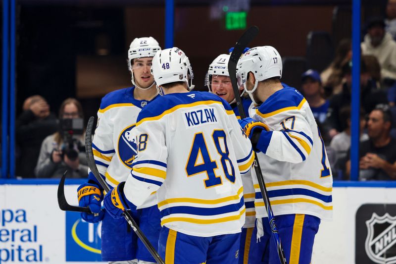 Feb 28, 2026; Tampa, Florida, USA; Buffalo Sabres defenseman Zach Metsa (73) celebrates a goal with forward Jack Quinn (22), and forward Tyson Kozak (48) and forward Jason Zucker (17) against the Tampa Bay Lightning during the second period at Benchmark International Arena. Mandatory Credit: Morgan Tencza-Imagn Images