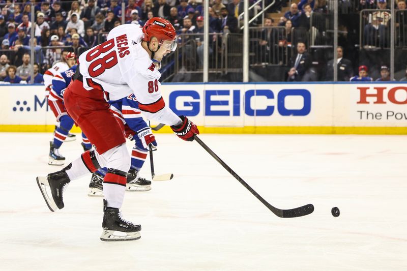 May 5, 2024; New York, New York, USA; Carolina Hurricanes center Martin Necas (88) attempts a shot on goal in the first period against the New York Rangers in game one of the second round of the 2024 Stanley Cup Playoffs at Madison Square Garden. Mandatory Credit: Wendell Cruz-USA TODAY Sports