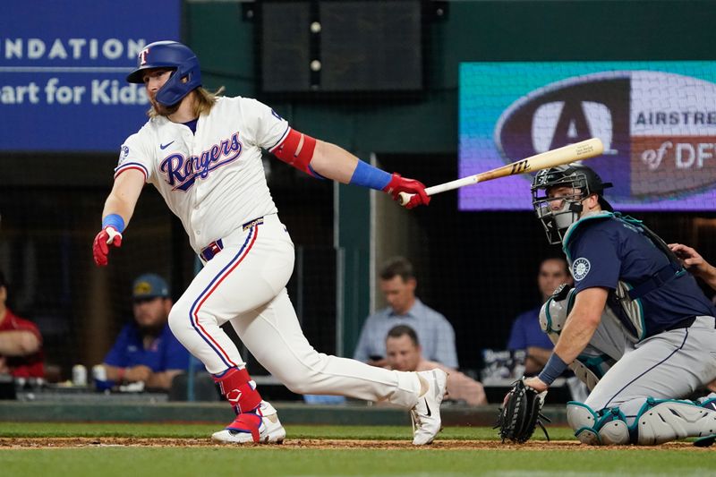 Apr 25, 2024; Arlington, Texas, USA; Texas Rangers third base Davis Wendzel (38) gets is his first major league hit during the eighth inning against the Seattle Mariners at Globe Life Field. Mandatory Credit: Raymond Carlin III-USA TODAY Sports