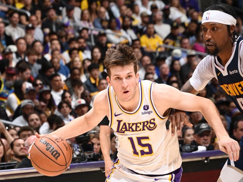 LOS ANGELES, CA - APRIL 27: Austin Reaves #15 of the Los Angeles Lakers dribbles the ball during the game against the Denver Nuggets during Round 1 Game 4 of the 2024 NBA Playoffs on April 27, 2024 at Crypto.Com Arena in Los Angeles, California. NOTE TO USER: User expressly acknowledges and agrees that, by downloading and/or using this Photograph, user is consenting to the terms and conditions of the Getty Images License Agreement. Mandatory Copyright Notice: Copyright 2024 NBAE (Photo by Andrew D. Bernstein/NBAE via Getty Images)