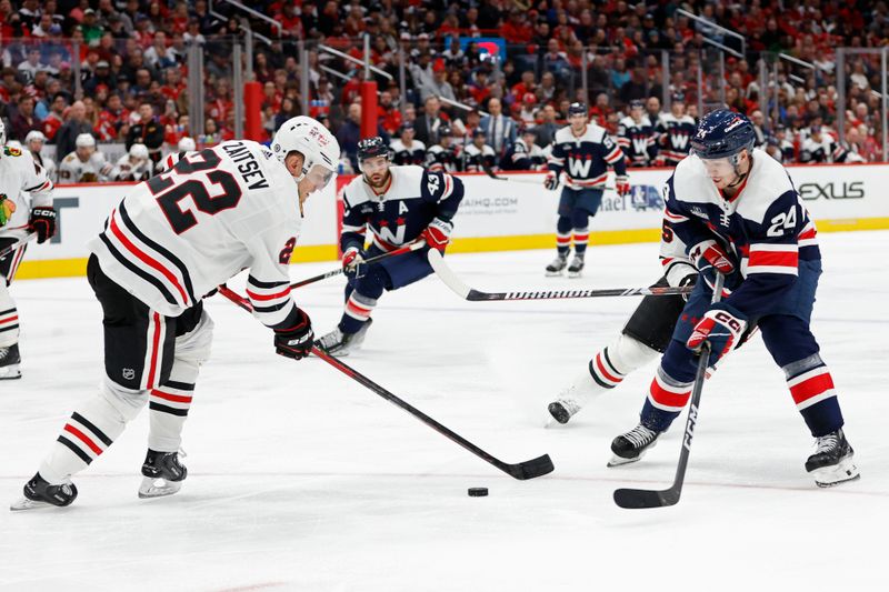 Mar 9, 2024; Washington, District of Columbia, USA; Washington Capitals center Connor McMichael (24) skates with the puck as Chicago Blackhawks defenseman Nikita Zaitsev (22) defends in the third period at Capital One Arena. Mandatory Credit: Geoff Burke-USA TODAY Sports