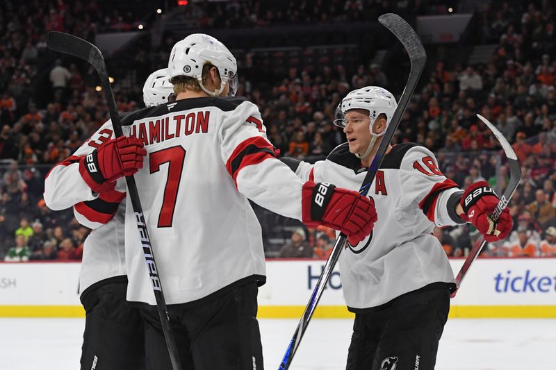 Jan 27, 2025; Philadelphia, Pennsylvania, USA; New Jersey Devils defenseman Dougie Hamilton (7) celebrates his goal with teammates against the Philadelphia Flyers during the second period at Wells Fargo Center. Mandatory Credit: Eric Hartline-Imagn Images