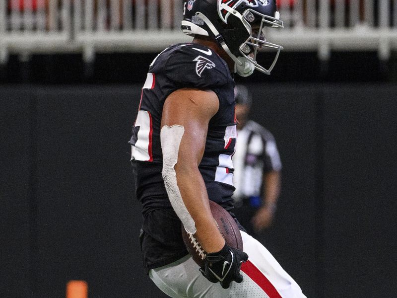 Atlanta Falcons running back Tyler Allgeier (25) scores a touchdown during the second half of an NFL football game against the Jacksonville Jaguars, Saturday, Aug. 27, 2022, in Atlanta. The Atlanta Falcons won 28-12. (AP Photo/Danny Karnik)