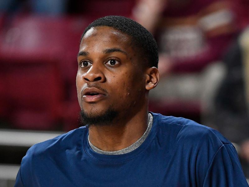 Feb 22, 2023; Chestnut Hill, Massachusetts, USA; A member of the Virginia Cavaliers men's basketball team wears a warmup jersey honoring fallen Virginia football classmates at Conte Forum. Mandatory Credit: Eric Canha-USA TODAY Sports