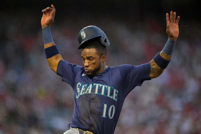 Jul 13, 2024; Anaheim, California, USA;  Victor Robles #10 of the Seattle Mariners gets back to first after J.P. Crawford #3 lined out in the fifth inning against the Los Angeles Angels at Angel Stadium. Mandatory Credit: Jayne Kamin-Oncea-USA TODAY Sports