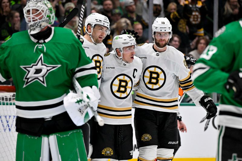 Nov 6, 2023; Dallas, Texas, USA; Boston Bruins left wing James van Riemsdyk (21) and left wing Brad Marchand (63) and center Pavel Zacha (18) celebrates a goal scored by Marchand \gainst Dallas Stars goaltender Jake Oettinger (29) during the third period at the American Airlines Center. Mandatory Credit: Jerome Miron-USA TODAY Sports