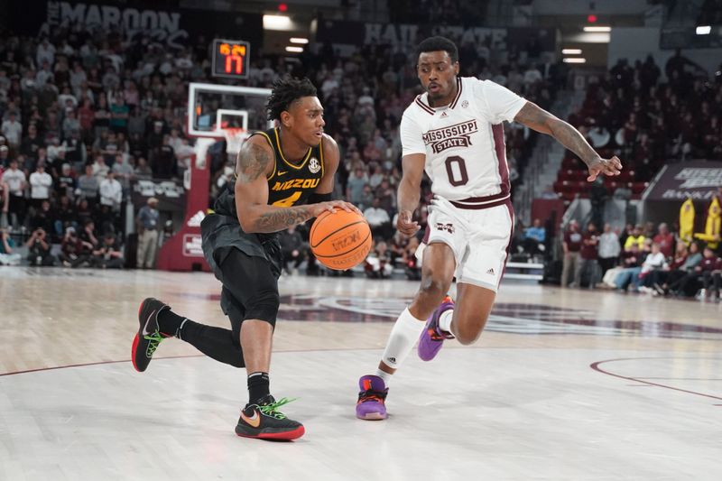 Feb 4, 2023; Starkville, Mississippi, USA; Missouri Tigers guard DeAndre Gholston (4) drives to the basket against Mississippi State Bulldogs forward D.J. Jeffries (0) during the second half at Humphrey Coliseum. Mandatory Credit: Matt Bush-USA TODAY Sports