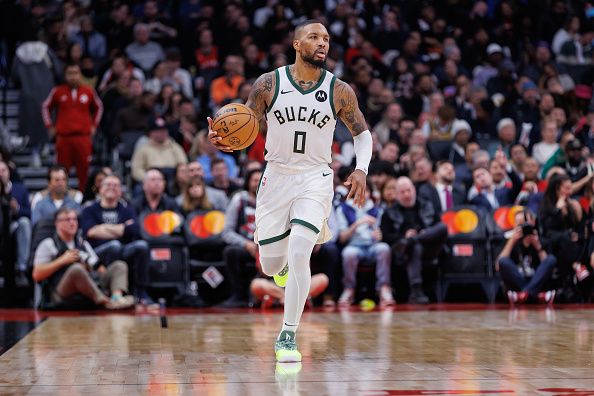 TORONTO, CANADA - NOVEMBER 15: Damian Lillard #0 of the Milwaukee Bucks dribbles up court during the second half of their NBA game against the Toronto Raptors at Scotiabank Arena on November 15, 2023 in Toronto, Canada. NOTE TO USER: User expressly acknowledges and agrees that, by downloading and or using this photograph, User is consenting to the terms and conditions of the Getty Images License Agreement. (Photo by Cole Burston/Getty Images)