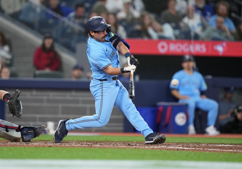 May 11, 2024; Toronto, Ontario, CAN; Toronto Blue Jays left fielder Davis Schneider (36) hits a home run against the Minnesota Twins during the fifth inning at Rogers Centre. Mandatory Credit: Nick Turchiaro-USA TODAY Sports