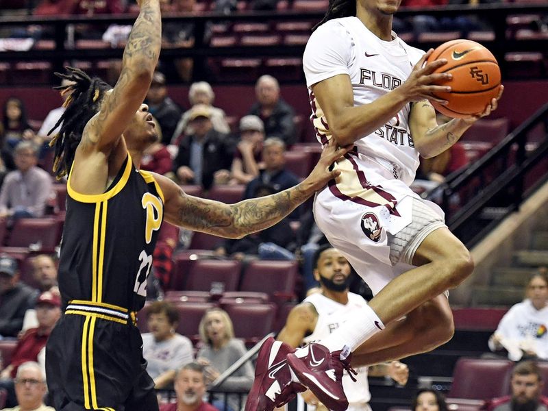 Feb 11, 2023; Tallahassee, Florida, USA; Florida State Seminoles guard Caleb Mills (4) goes up for a shot during the first half against the Pittsburgh Panthers at Donald L. Tucker Center. Mandatory Credit: Melina Myers-USA TODAY Sports