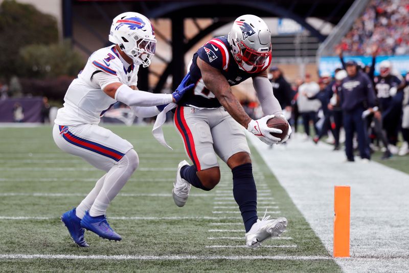 New England Patriots wide receiver Kendrick Bourne (84) crosses the goal line for a touchdown against Buffalo Bills cornerback Taron Johnson (7) during the second half of an NFL football game, Sunday, Oct. 22, 2023, in Foxborough, Mass. (AP Photo/Michael Dwyer)