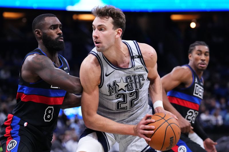 ORLANDO, FLORIDA - NOVEMBER 23: Franz Wagner #22 of the Orlando Magic goes to the basket against Tim Hardaway Jr. #8 of the Detroit Pistons during the third quarter at Kia Center on November 23, 2024 in Orlando, Florida. NOTE TO USER: User expressly acknowledges and agrees that, by downloading and/or using this photograph, user is consenting to the terms and conditions of the Getty Images License Agreement. (Photo by Rich Storry/Getty Images)