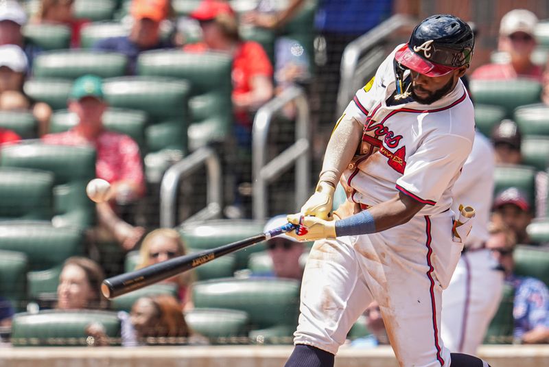 Apr 23, 2025; Cumberland, Georgia, USA; Atlanta Braves outfielder Michael Harris II (23) singles to drive in a run against the St. Louis Cardinals during the seventh inning at Truist Park. Mandatory Credit: Dale Zanine-Imagn Images