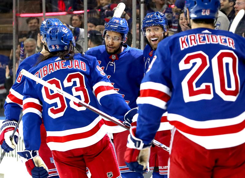 Nov 25, 2023; New York, New York, USA; New York Rangers defenseman K'Andre Miller (79) celebrates his goal with center Mika Zibanejad (93), right wing Blake Wheeler (17) and left wing Chris Kreider (20) during the second period against the Boston Bruins at Madison Square Garden. Mandatory Credit: Danny Wild-USA TODAY Sports