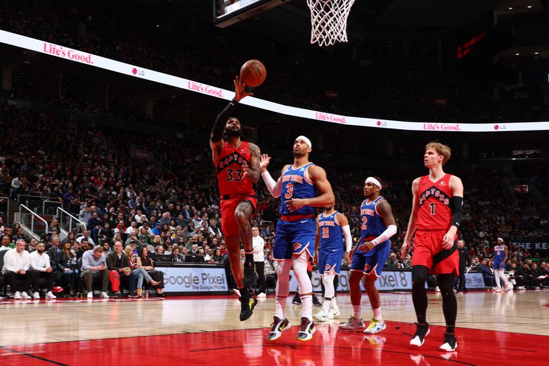 TORONTO, CANADA - MARCH 27: Gary Trent Jr. #33 of the Toronto Raptors drives to the basket during the game against the New York Knicks on March 27, 2024 at the Scotiabank Arena in Toronto, Ontario, Canada.  NOTE TO USER: User expressly acknowledges and agrees that, by downloading and or using this Photograph, user is consenting to the terms and conditions of the Getty Images License Agreement.  Mandatory Copyright Notice: Copyright 2024 NBAE (Photo by Vaughn Ridley/NBAE via Getty Images)