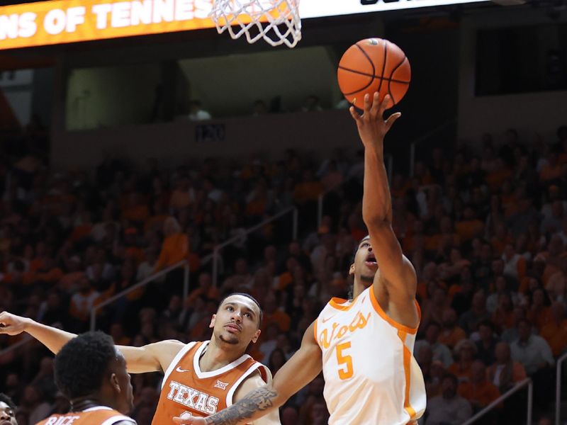 Jan 28, 2023; Knoxville, Tennessee, USA; Tennessee Volunteers guard Zakai Zeigler (5) goes to the basket against the Texas Longhorns during the second half at Thompson-Boling Arena. Mandatory Credit: Randy Sartin-USA TODAY Sports