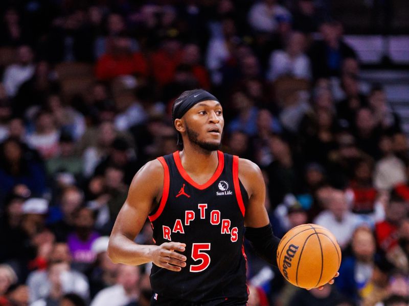 TORONTO, CANADA - JANUARY 3: Immanuel Quickley #5 of the Toronto Raptors dribbles the ball up the court against the Orlando Magic during the second half of their NBA game at Scotiabank Arena on January 3, 2025 in Toronto, Canada. NOTE TO USER: User expressly acknowledges and agrees that, by downloading and or using this photograph, User is consenting to the terms and conditions of the Getty Images License Agreement. (Photo by Cole Burston/Getty Images)