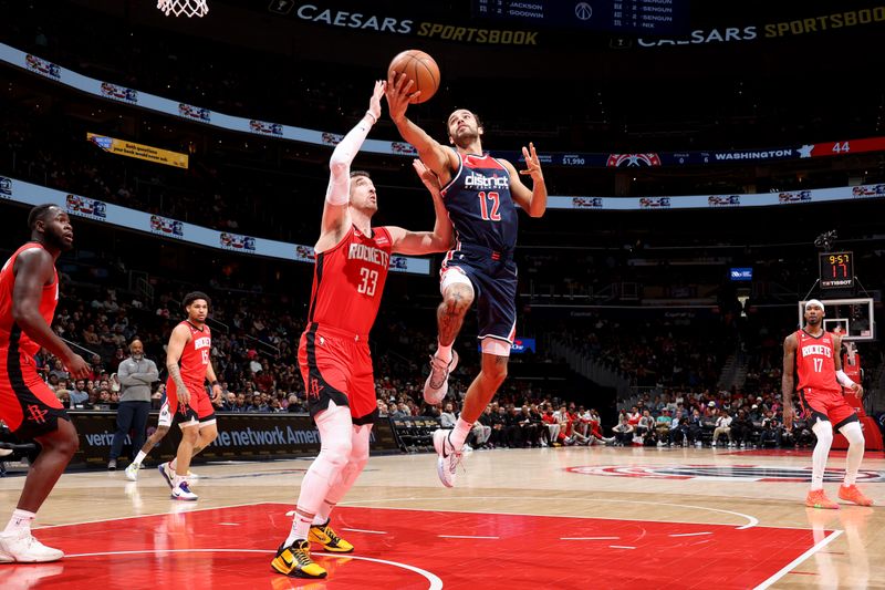 WASHINGTON, DC -? APRIL 9: Xavier Cooks #12 of the Washington Wizards drives to the basket against the Houston Rockets  on April 9, 2023 at Capital One Arena in Washington, DC. NOTE TO USER: User expressly acknowledges and agrees that, by downloading and or using this Photograph, user is consenting to the terms and conditions of the Getty Images License Agreement. Mandatory Copyright Notice: Copyright 2023 NBAE (Photo by Stephen Gosling/NBAE via Getty Images)